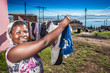 Photo: Woman busy with her family's laundry Woman busy with her family's laundry