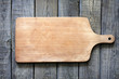 Photo: Empty vintage cutting board on planks food background concept Empty vintage cutting board on planks food background concept