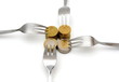 concept of tight budget with coins and fork