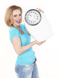 Foto: Beautiful woman with a dream figur holding a pair of scale Beautiful woman with a dream figur holding a pair of scale