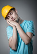 worker in helmet sleeps