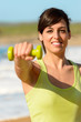 Photo: Happy fitness woman with dumbbell Happy fitness woman with dumbbell