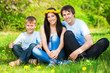 happy family in a green park. summer