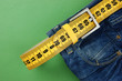 jeans with meter belt slimming on the green background