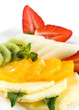 Fresh fruits with peppermint on white