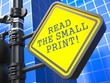 Roadsign with  'Read the Small Print' Concept.