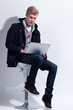 Photo: Young man in coat with notebook Young man in coat with notebook
