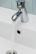 Tap with flowing water over the sink