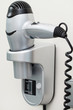 Hairdryer with cord attached to a wall