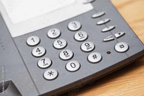 Photo: Closeup image of office phone Closeup image of office phone