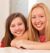 Photo: Happy caucasian sisters at home Happy caucasian sisters at home