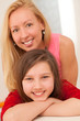 Photo: Happy caucasian sisters at home Happy caucasian sisters at home