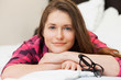 Photo: Cute young girl relaxing on the bed Cute young girl relaxing on the bed