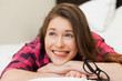 Photo: Funny young girl relaxing on the bed Funny young girl relaxing on the bed