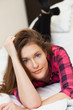 Photo: Cute young girl relaxing on the bed Cute young girl relaxing on the bed