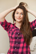 Photo: Cute young girl holding her hair Cute young girl holding her hair