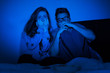 Photo: Caucasian couple watching scary movie Caucasian couple watching scary movie