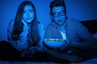 Photo: Caucasian couple watching scary movie Caucasian couple watching scary movie