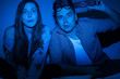 Photo: Caucasian couple watching scary movie Caucasian couple watching scary movie