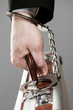 Case attached to hand with handcuffs