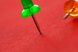 Photo: Colorful pushpins on a red surface Colorful pushpins on a red surface