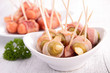 Foto: olive and sausage wrapped in bacon olive and sausage wrapped in bacon