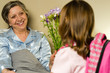 Little girl visiting her ill grandmother
