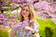 Photo: Beautiful woman in spring blossom Beautiful woman in spring blossom
