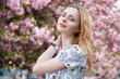 Photo: Beautiful woman in spring blossom Beautiful woman in spring blossom