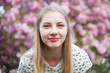 Photo: Beautiful woman in spring blossom Beautiful woman in spring blossom
