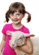 happy little girl with a lamb