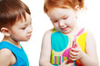 boy and girl playing with mobile