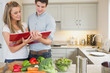 Couple reading cookbook
