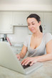 Photo: Woman typing on a laptop Woman typing on a laptop