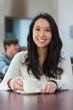 Smiling student in a coffee shop