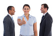 Businesswoman giving her hand in the middle of two businessmen