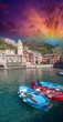 Colorful boats in the quaint port of Vernazza, Cinque Terre - It