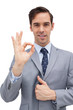 Smiling businessman showing ok sign