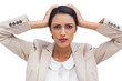 Foto: Stressed businesswoman holding her head between hands Stressed businesswoman holding her head between hands