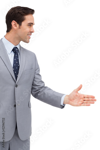 Photo: Businessman giving his hand Businessman giving his hand