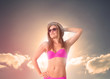Photo: Woman wearing a straw hat relaxing under the sun Woman wearing a straw hat relaxing under the sun