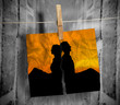 Foto: Torn photo of couple hung with a peg on a line Torn photo of couple hung with a peg on a line