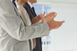 Business people applauding together