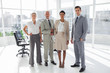 Photo: Group of business people standing in line Group of business people standing in line