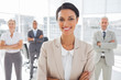 Attractive businesswoman with arms crossed