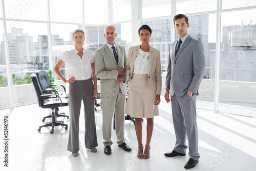 Photo: Group of business people standing in line Group of business people standing in line