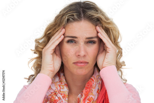 Photo: Blonde woman suffering with headache Blonde woman suffering with headache