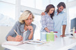 Photo: Designer is working in her bright office Designer is working in her bright office