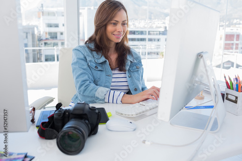 Photo: Photo editor working on computer Photo editor working on computer