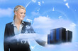 Photo: Businesswoman looking at data servers Businesswoman looking at data servers
